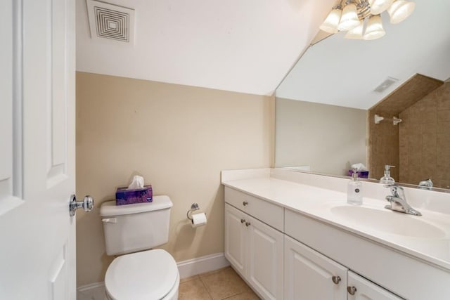 bathroom featuring toilet, tile floors, and vanity with extensive cabinet space