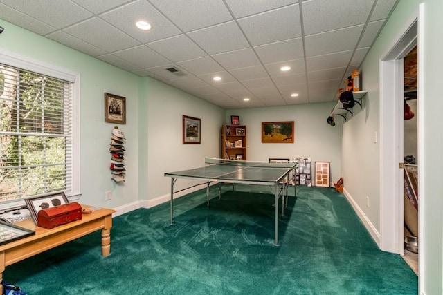 playroom with a paneled ceiling and plenty of natural light