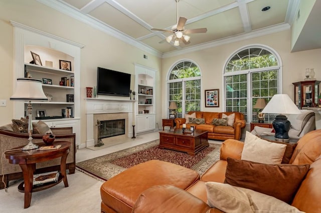 living room featuring coffered ceiling, built in features, ceiling fan, and a wealth of natural light