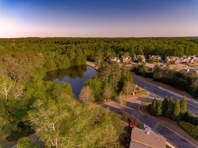 aerial view at dusk with a water view