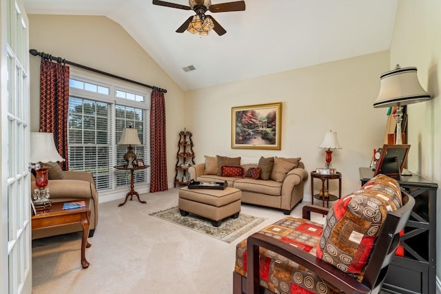 living room with lofted ceiling, light carpet, and ceiling fan