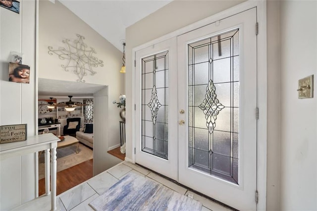 entryway featuring french doors, lofted ceiling, and ceiling fan