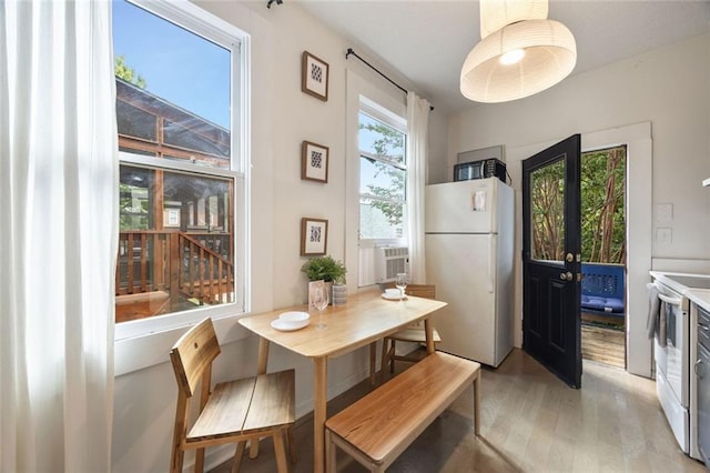 66 Howell St NE, Atlanta, GA 30312 - dining area with light wood-style floors and cooling unit