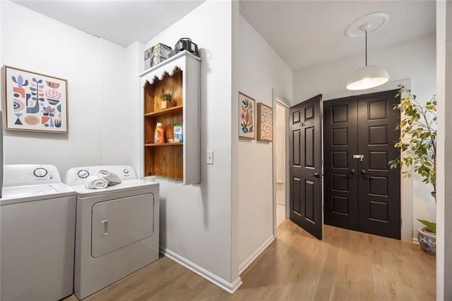 66 Howell St NE, Atlanta, GA 30312 - washroom featuring wood finished floors, independent washer and dryer, and baseboards