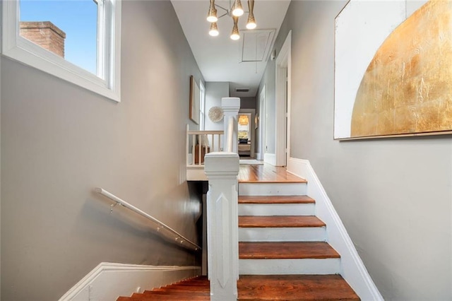 66 Howell St NE, Atlanta, GA 30312 - stairs featuring attic access, wood finished floors, and baseboards
