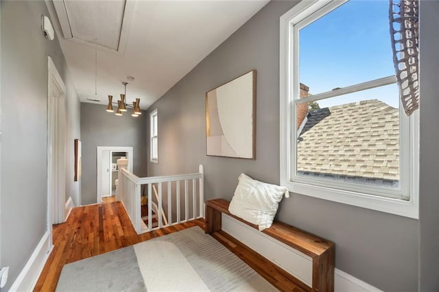 66 Howell St NE, Atlanta, GA 30312 - hallway with attic access, an upstairs landing, wood finished floors, and plenty of natural light