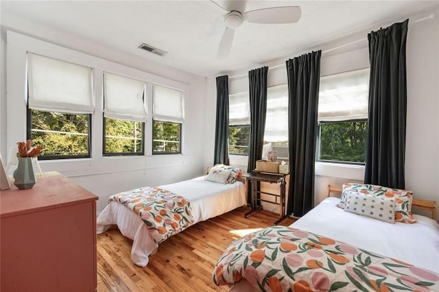 66 Howell St NE, Atlanta, GA 30312 - bedroom featuring multiple windows, light wood-type flooring, and a ceiling fan