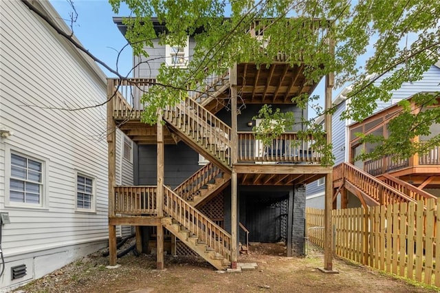 66 Howell St NE, Atlanta, GA 30312 - back of property with stairs and a wooden deck