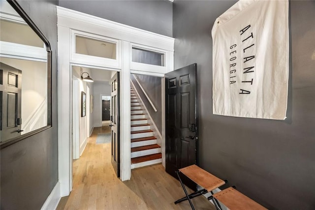 66 Howell St NE, Atlanta, GA 30312 - entryway featuring light wood-type flooring, stairs, and baseboards