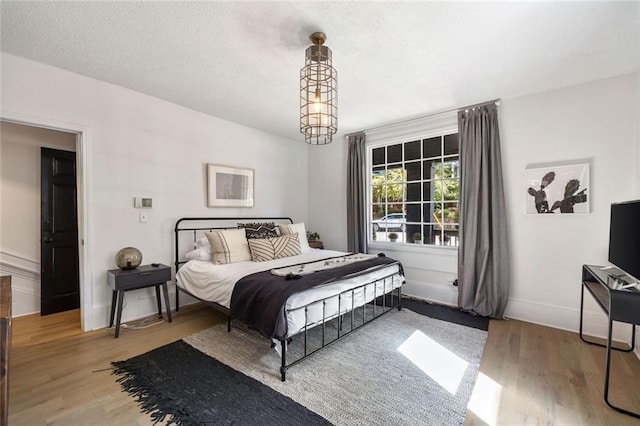 66 Howell St NE, Atlanta, GA 30312 - bedroom with light wood-style flooring and baseboards