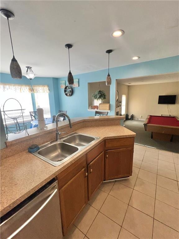 kitchen featuring billiards, decorative light fixtures, dishwasher, sink, and light tile patterned floors