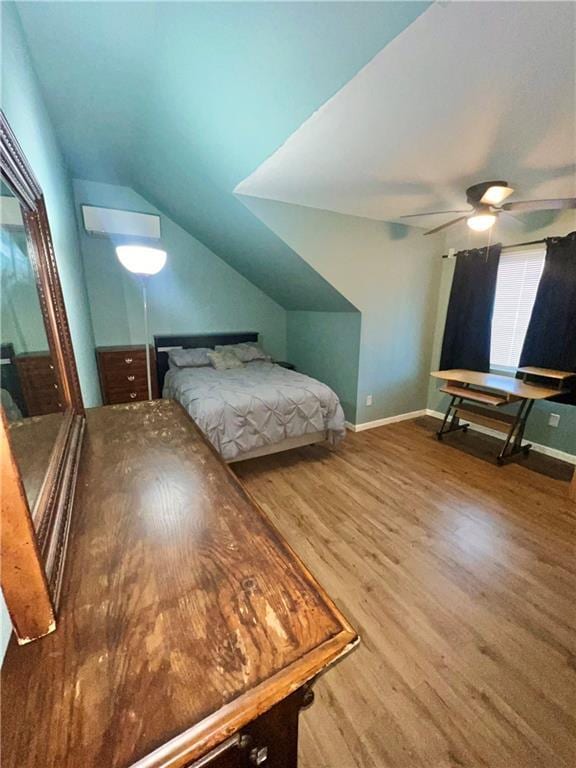 bedroom featuring hardwood / wood-style flooring, vaulted ceiling, and ceiling fan