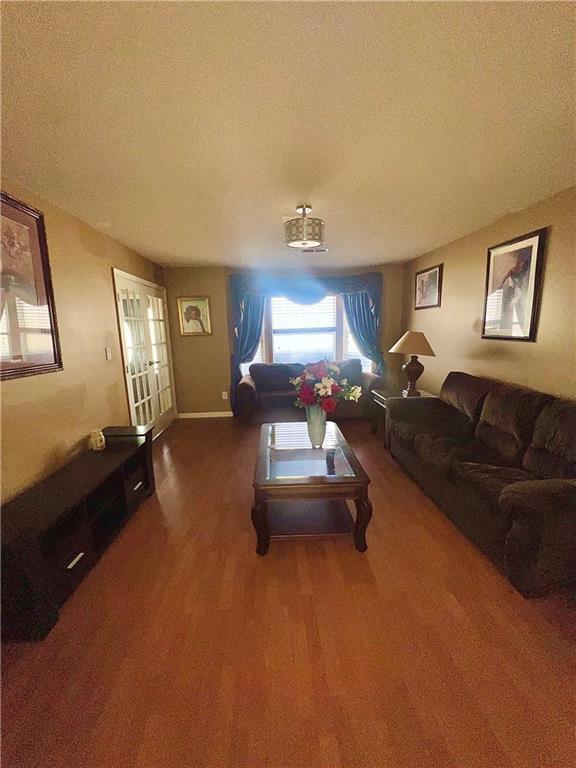 living room with wood-type flooring