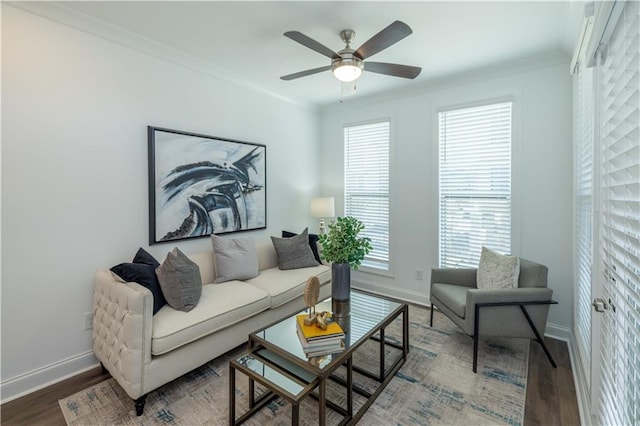 living room with hardwood / wood-style floors, crown molding, and plenty of natural light