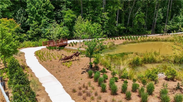 surrounding community featuring a view of trees