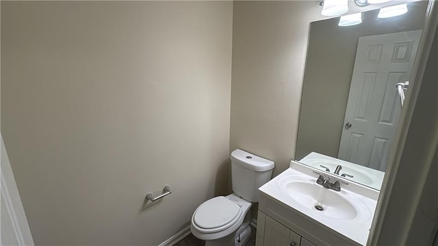 bathroom with toilet and vanity