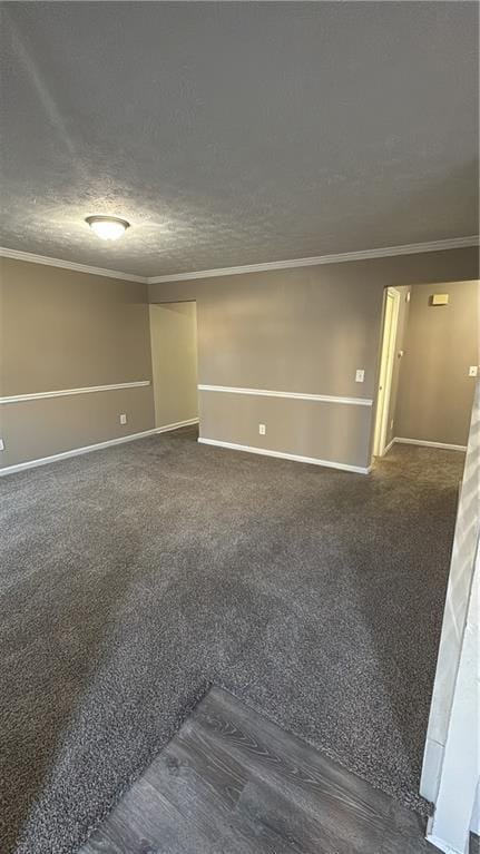 unfurnished room featuring a textured ceiling and ornamental molding