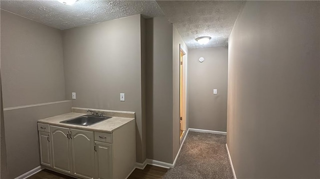 bathroom with vanity and a textured ceiling