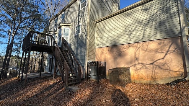 view of side of property with a wooden deck