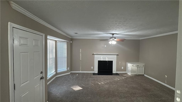 unfurnished living room featuring ceiling fan, dark carpet, a textured ceiling, and crown molding