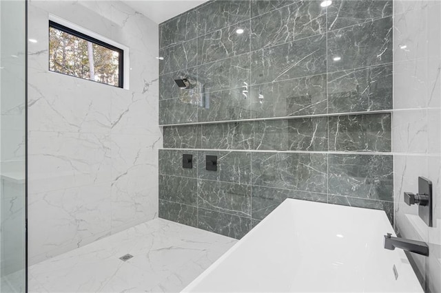 bathroom with a tile shower