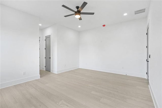 empty room featuring light wood-type flooring and ceiling fan