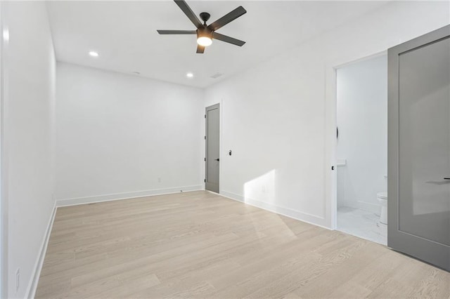 spare room featuring ceiling fan and light hardwood / wood-style floors