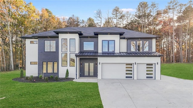 view of front facade featuring a garage and a front lawn