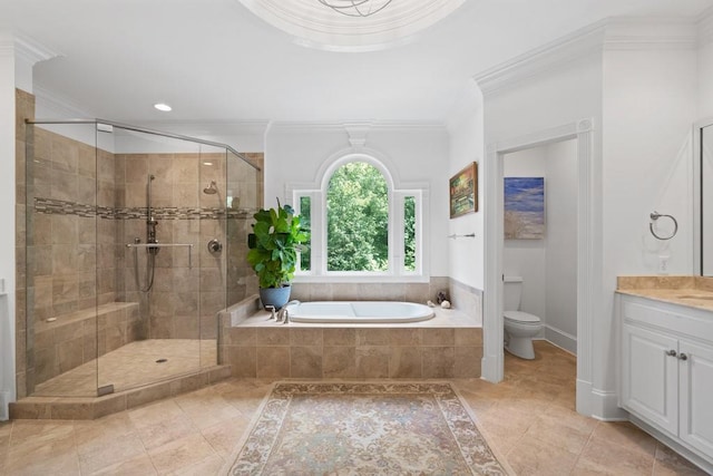 full bathroom featuring independent shower and bath, vanity, crown molding, and toilet