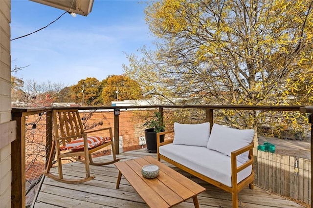 wooden terrace featuring an outdoor hangout area