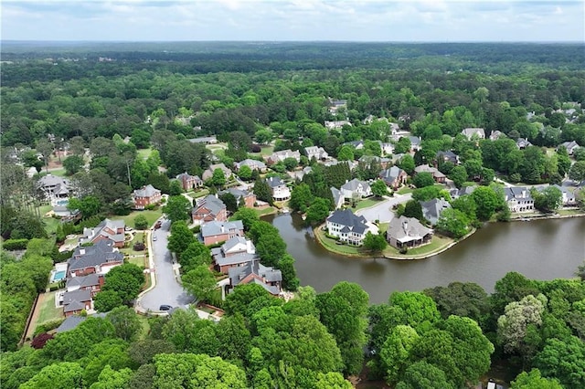 bird's eye view with a residential view, a water view, and a forest view