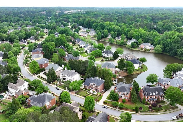 aerial view with a water view, a residential view, and a forest view