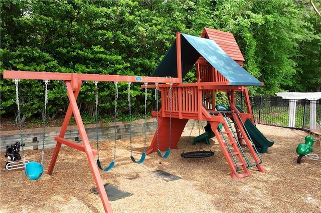 view of jungle gym with fence