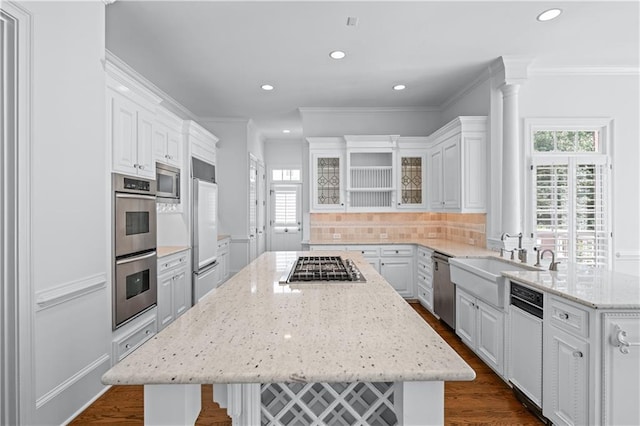 kitchen featuring recessed lighting, dark wood-type flooring, appliances with stainless steel finishes, and a healthy amount of sunlight