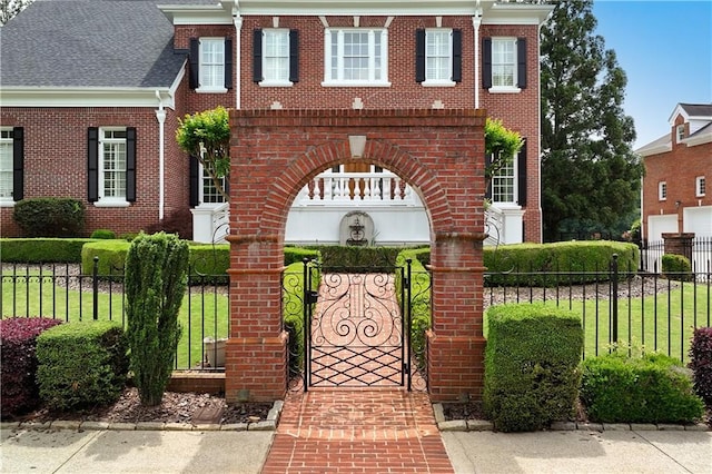view of front facade with brick siding and fence