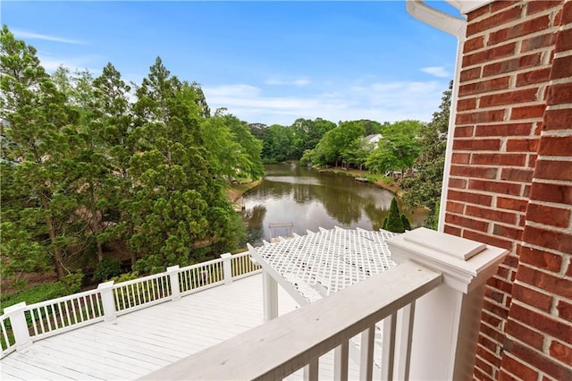 wooden deck featuring a water view