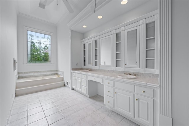 full bath with double vanity, ornamental molding, a sink, and tile patterned flooring