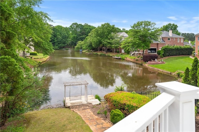property view of water featuring fence