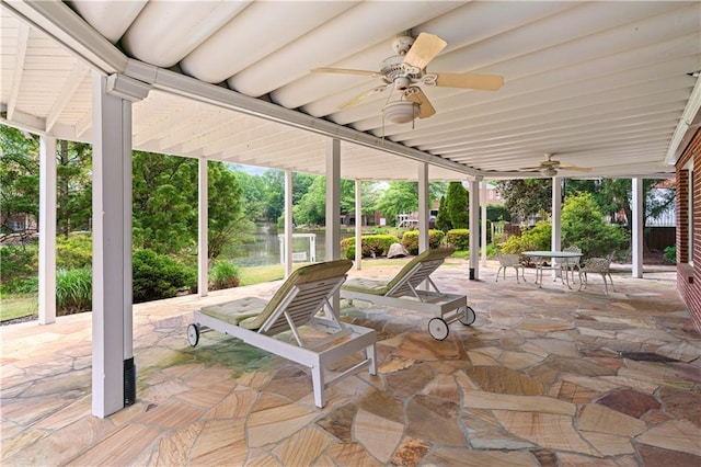 view of patio with ceiling fan and outdoor dining space