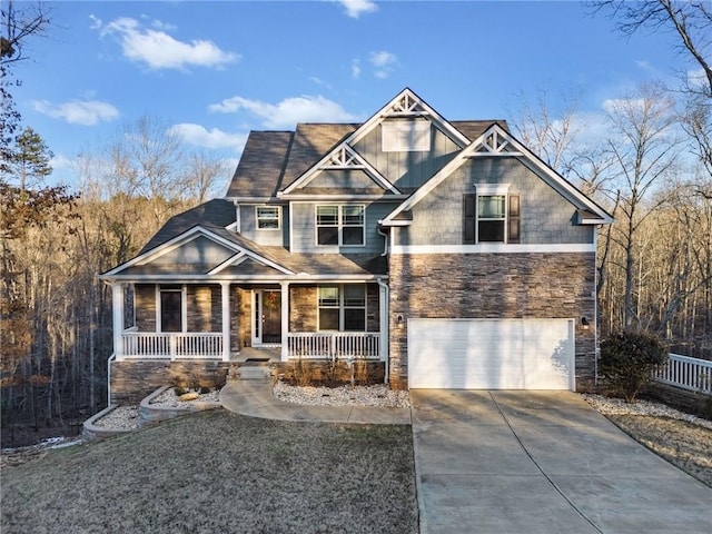 craftsman inspired home featuring a garage, stone siding, covered porch, and driveway