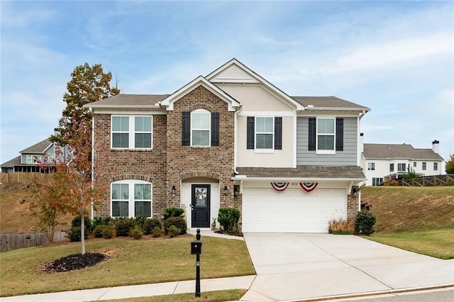 view of front of home featuring a front yard and a garage