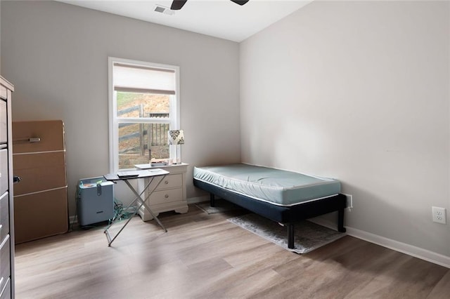 bedroom featuring light hardwood / wood-style flooring and ceiling fan