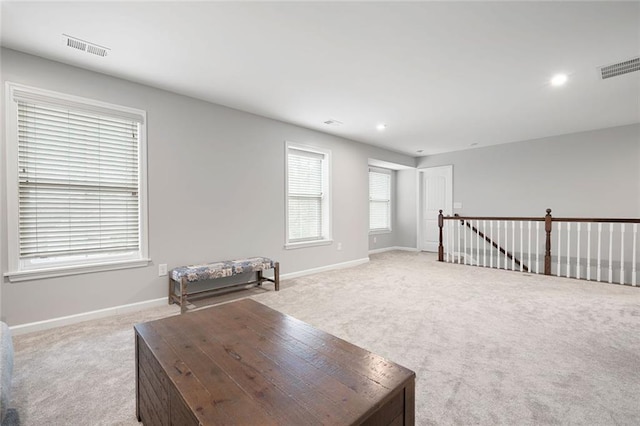 interior space featuring light colored carpet