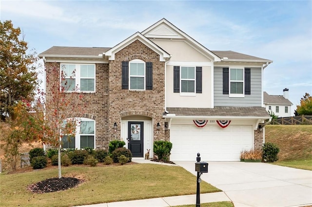 view of front facade featuring a front yard and a garage