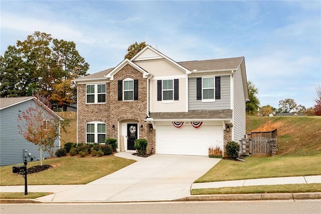 view of front of house featuring a garage and a front lawn