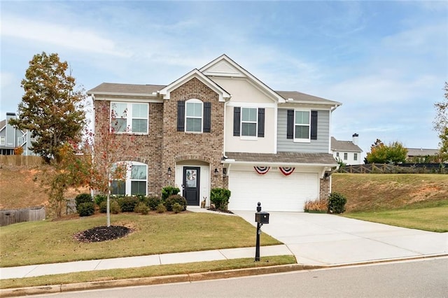 view of front of home with a front lawn and a garage