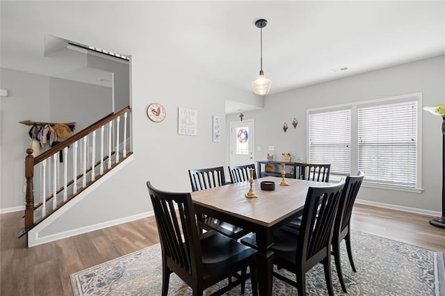 dining area with hardwood / wood-style flooring