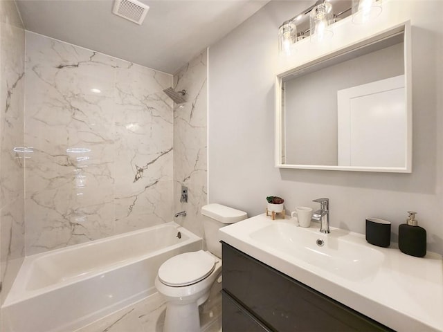 full bathroom with toilet, tiled shower / bath combo, and vanity with extensive cabinet space