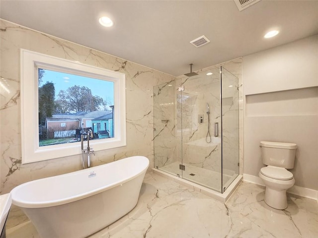 bathroom featuring tile floors, a wealth of natural light, toilet, and independent shower and bath