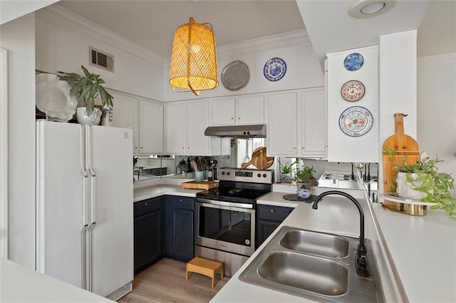 3777 Peachtree Rd NE Unit 1227, Brookhaven, GA 30319 - kitchen featuring freestanding refrigerator, electric stove, under cabinet range hood, white cabinets, and ornamental molding